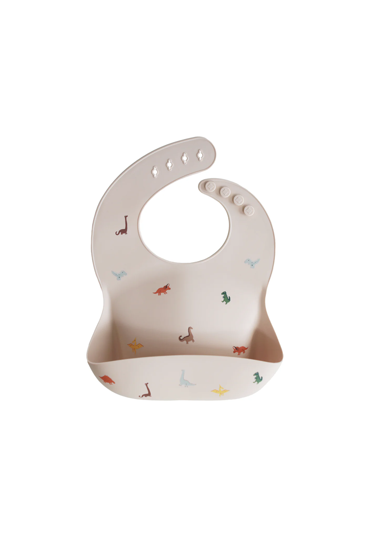 Bavoir en silicone Mushie pour bébé, dinosaures